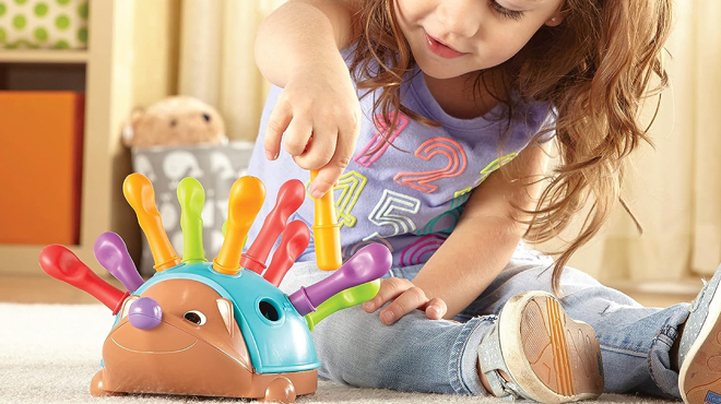 Girl Playing with Learning Resources The Fine Motor Hedgehog