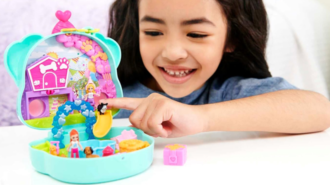 Girl Playing with Polly Pocket Compact Playset