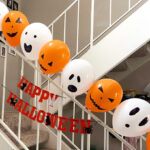 Halloween Balloons Arranged on a Railing