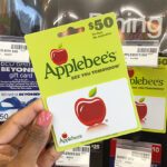 Hand Holding Applebees Gift Card