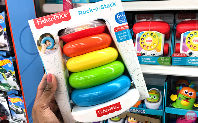 Hand Holding Fisher Price Rock a Stack Baby Stacking Toy