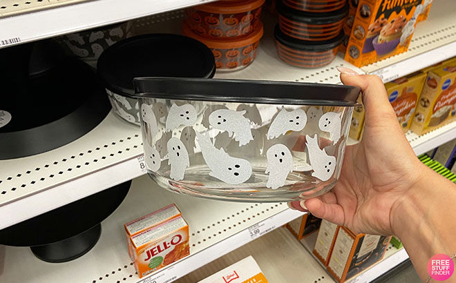 Hand Holding a Halloween Glass Containers Ghost Design