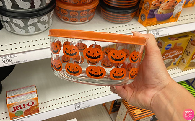 Hand Holding a Halloween Glass Containers Pumpkin Design