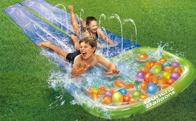 Kids Playing on Bunch O Balloons Water Slide Wipeout 2 Lane