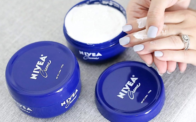 Lady Applying Nivea Moisturizing Cream on her Hand