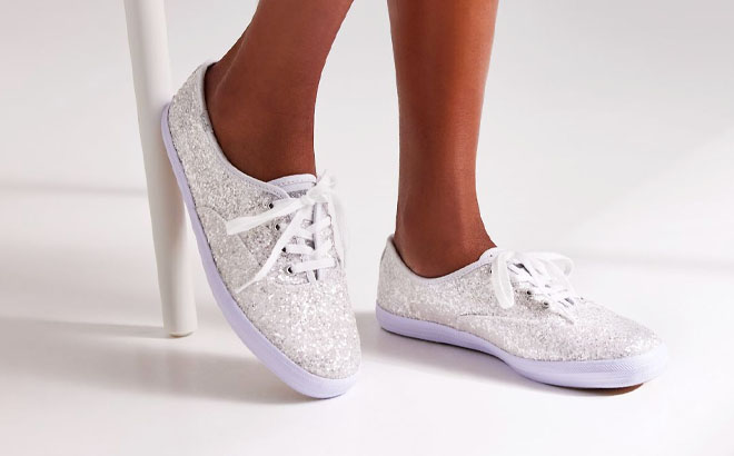 Model Wearing a Keds Womens Champion Glitter Celebration Sneakers