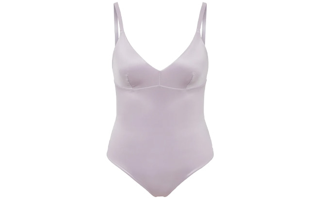 Spanx Shaping Satin Thong Bodysuit in Light Orchid Color on Plain Background