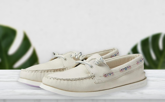 Sperry Womens Authentic Original Leather Beaded Boat Shoe in Off White Color on the Table