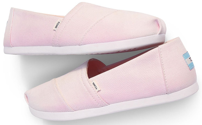 TOMS Pink Color Changing Alpargata Womens Shoes on a Plain Background