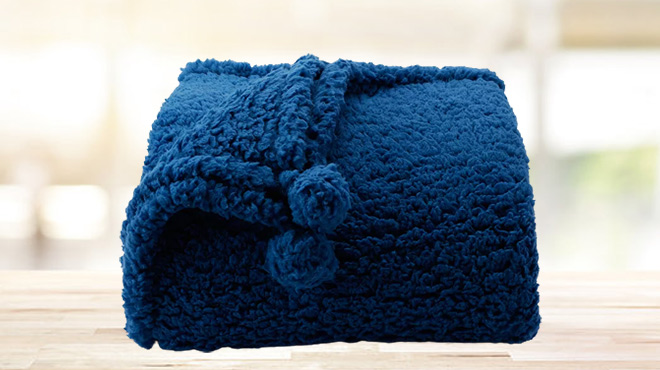 The Big One Kids Sherpa Pom Throw in Dark Blue Color