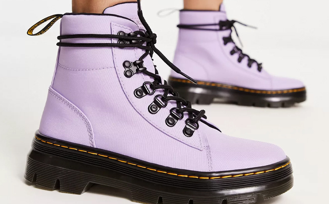 Woman Wearing Dr Martens Combs Booties in Lilac Purple Color