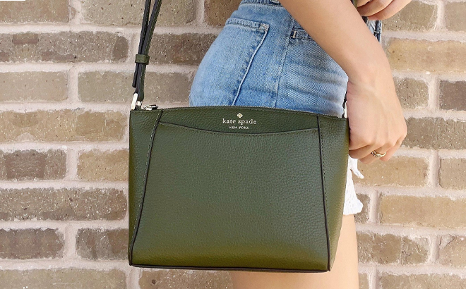 Woman Wearing Kate Spade Monica Crossbody in Enchanted Green Color