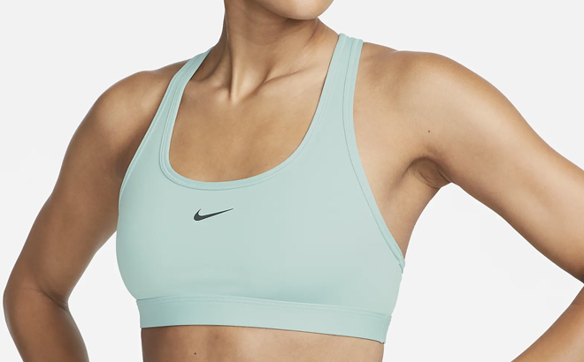 Woman Wearing Nike Swoosh Light Support Non Padded Sports Bra