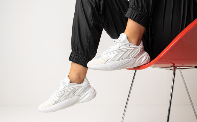 Woman is Wearing Adidas Ozelia Shoes in Cloud and Crystal White Color