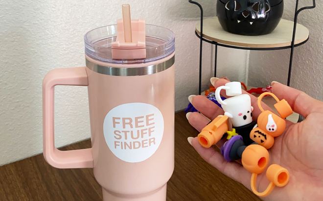 https://www.freestufffinder.com/wp-content/uploads/2023/09/hand-holding-straw-covers-next-to-an-insulated-tumbler.jpg