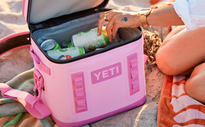 opened YETI 8 Soft Cooler with cans of beverage inside