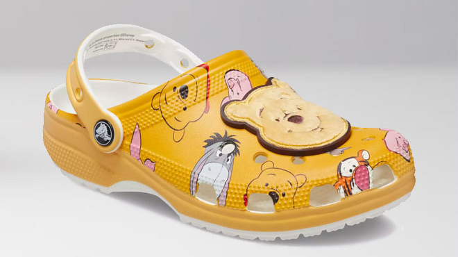 A Pair of Disney Crocs Winnie the Pooh Clogs for Adults