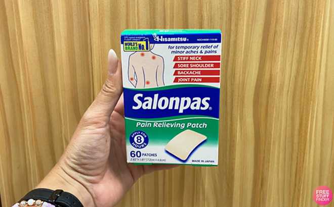 A Person Holding a Salonpas 60 Count Pain Relieving Patch