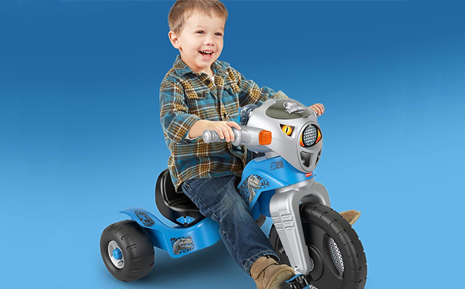 Boy Riding the Fisher Price Jurassic World Toddler Tricycle