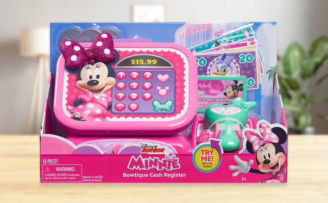 Disney Junior Minnie Mouse Bowtique Cash Register on a Table