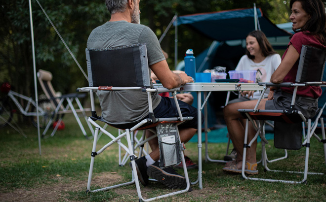 Family are Sitting on Decathlon Quechua Folding Camping Chairs in Gray Color