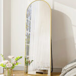 Full Length Arched Standing Mirror Inside a Bedroom