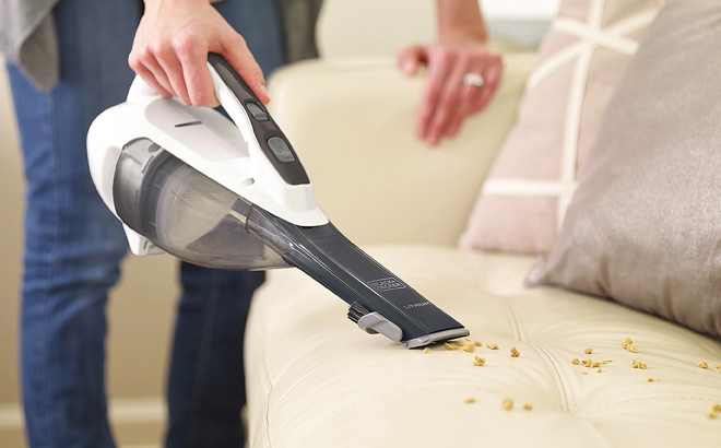 Hand Holding BLACKDECKER Lithium Cordless Hand Vacuum with Scented Filter