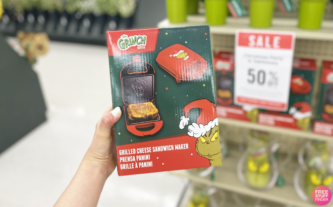 Hand Holding The Grinch Grilled Cheese Sandwich Maker