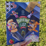 Hand Holding Walmarts Flyer for Find Your Top of the List Thing Toys