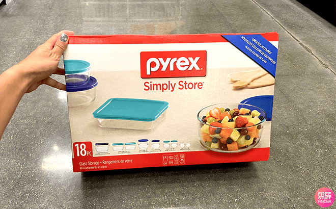 Hand Holding a Box of Pyrex Simply Store 18 Piece Food Storage Set