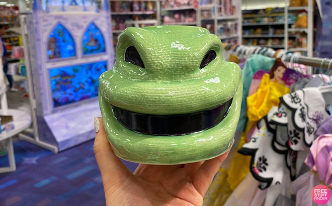 Hand Holding up the Oogie Boogie Candy Dish at Target Aisle