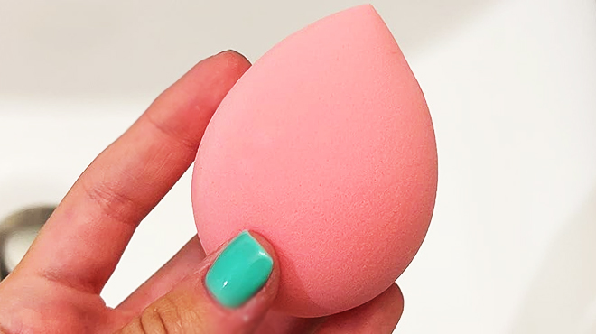 Hand holding a Beakey Makeup Sponge