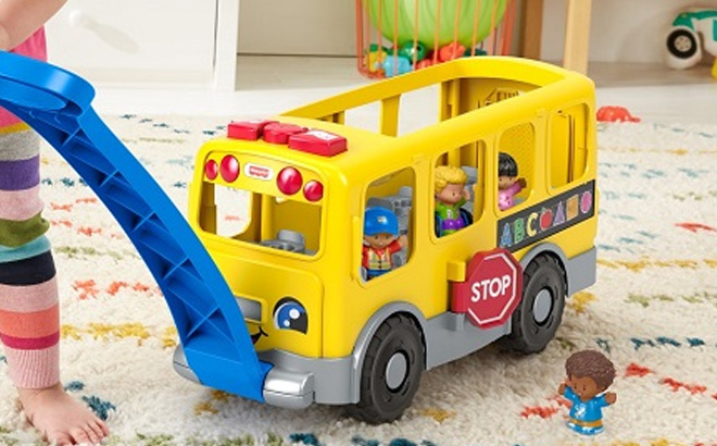 Kid Playing with Fisher Price Little People Big Yellow Bus