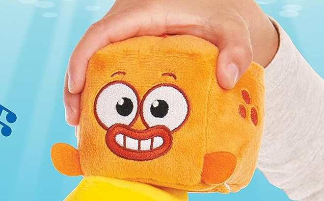 Kid is Holding WowWee Baby Sharks Big Show Song Cube William The Goldfish Singing Plush Toy