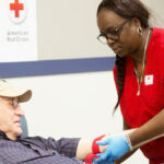 Man Donating Blood at Red Cross