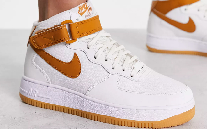 Person Wearing Nike Air Force 1 '07 Mid Sneakers in Desert Ochre