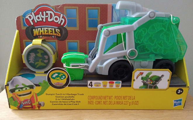 Play Doh Toy Garbage Truck Set on a Wooden Table