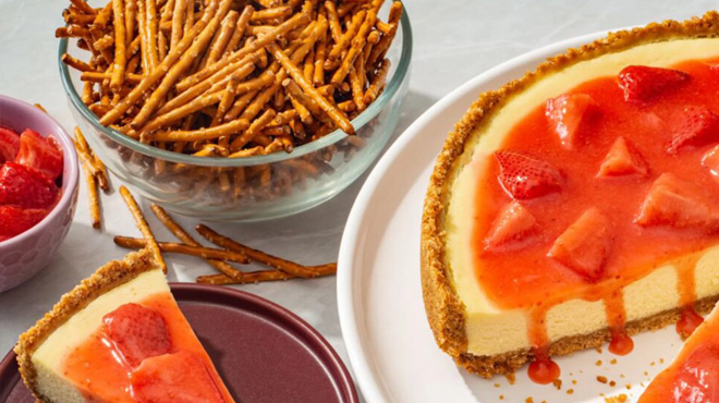 Rose Gold Pretzel Sticks in a Bowl next to a Cake