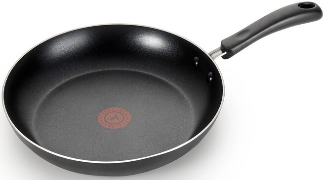 T Fal Essentials Frypan in Black Color on a Plain Background