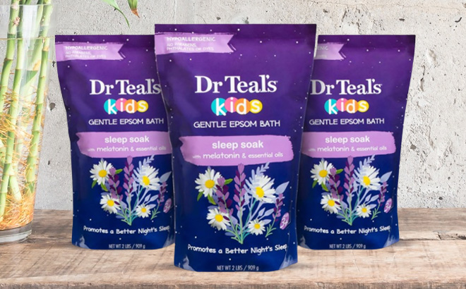 Three Bags of Dr Teals Epsom Salt on Wooden Table