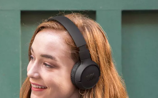 Woman Using JBL Tune Wireless On Ear Headphones 510BT in Black