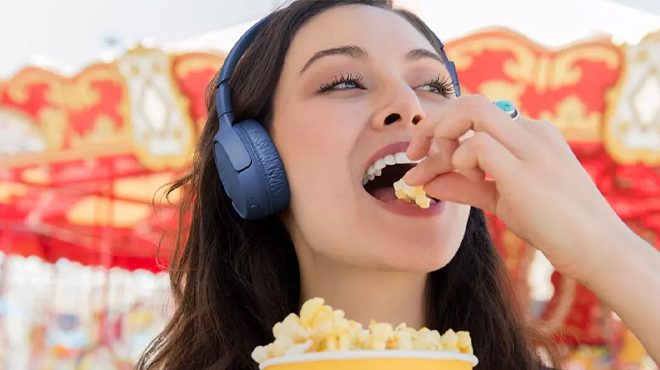 Woman Using JBL Tune Wireless On Ear Headphones 510BT in Blue