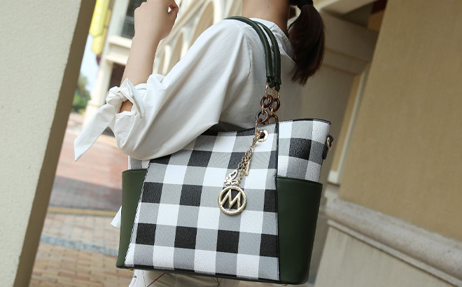 Woman is Holding MKF Collection Bonita Checker Vegan Leather Womens Tote Handbag Wristlet Wallet