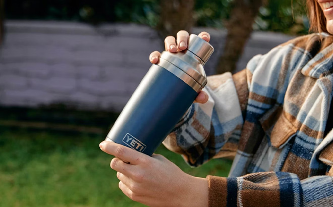 Woman is Holding YETI Rambler Cocktail Shaker in Navy Color