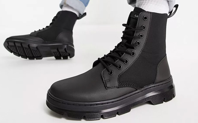 Woman is Wearing Dr Martens Combs II Boots in Black Color