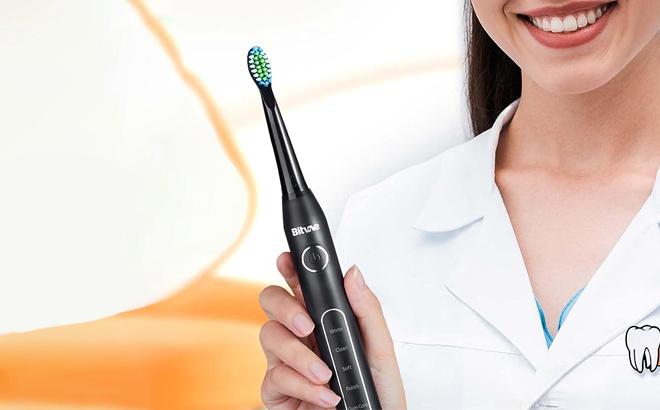 a Dentist Holding a Bitvae Ultrasonic Electric Toothbrush