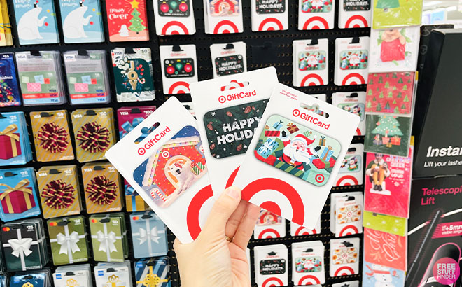 A Hand Holding a Three Pieces of Target Gift Cards