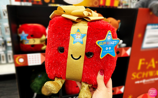 A Person Holding FAO Schwarz Glow Brights Hot Cocoa Plush