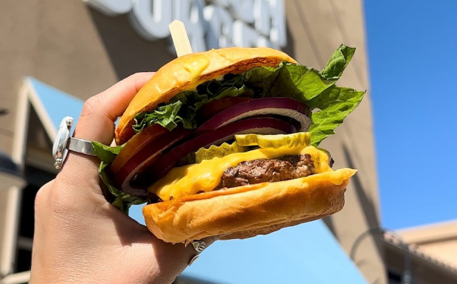 A Person Holding a Smashburger Burger