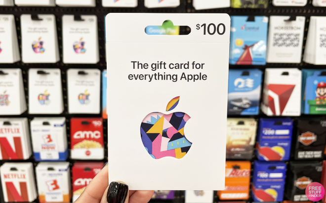 A Person Holding an Apple 100 Gift Card